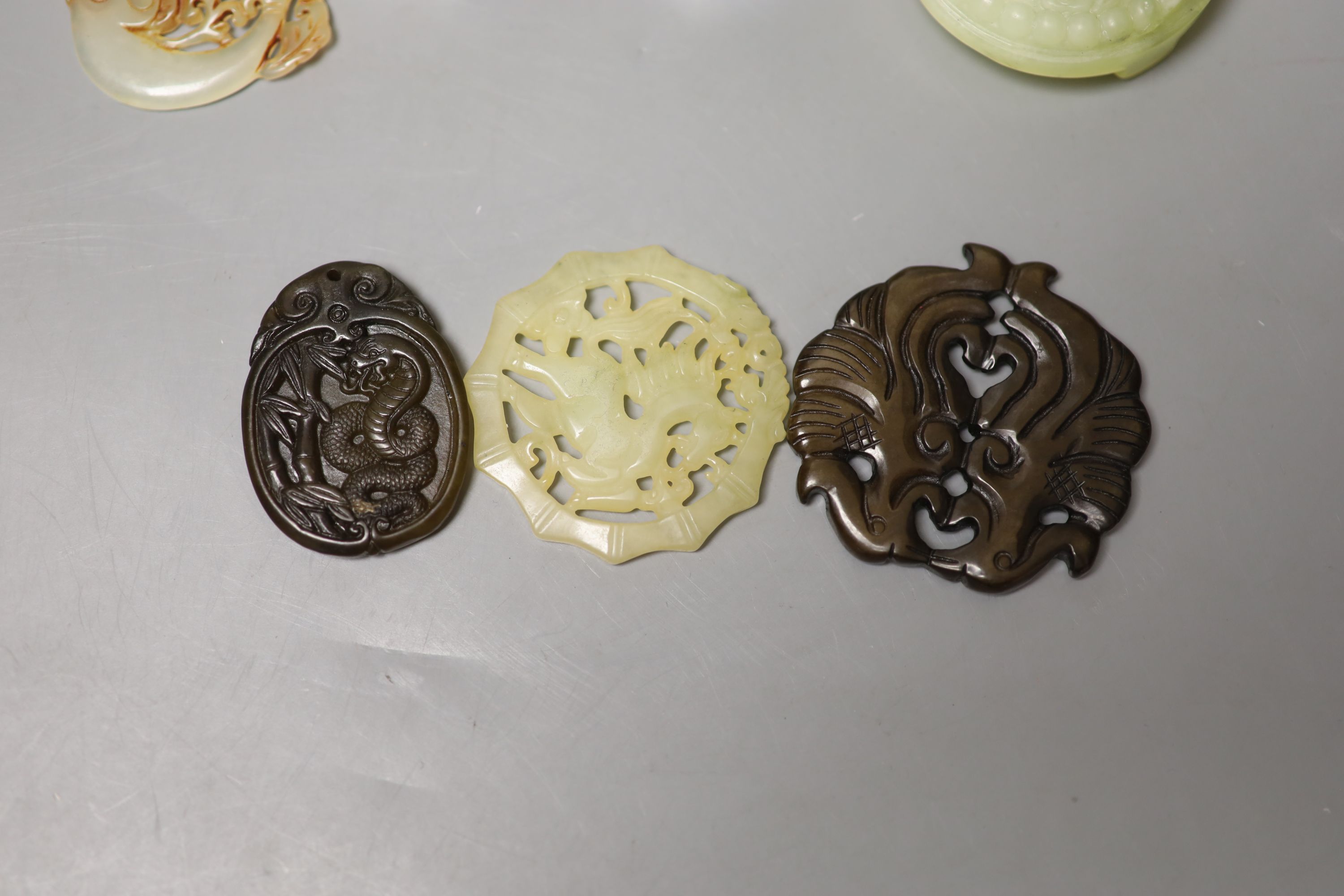 Eight Chinese hardstone pendants or archer's rings